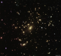 Hubble Sees Galaxy Cluster Warping Space and Time